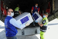 Boxes of protective masks are unloaded from a military airplane coming from Bucharest, Romania to Milan, Italy as part of the Operation RescEU in the context of the COVID-19 pandemic.